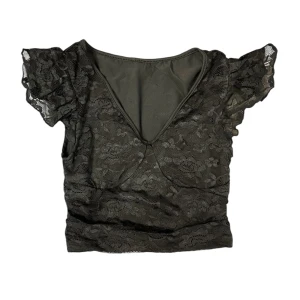 Svart fest topp - Tror den är storlek XS eller S, men tippar på XS