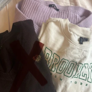 Två tröjor: lila stickad, vit sweatshirt. - Säljer två tröjor! En lila croppad stickad tröja från Gina Tricot, en vit sweatshirt med grönt Brooklyn-tryck från vero moda. Den bruna är såld. Om man inte vill ha båda är det bara att skriva till mig!💓 1 tröja= 25kr, 2 tröjor= 50kr
