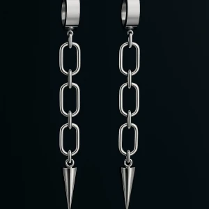 Silverfärgade kedjeörhängen med spetsdetalj - Snygga örhängen i silverfärg med breda ringar och kedjor som avslutas med en spetsig kon. Ger en edgy och modern look, perfekta för att lyfta din stil. Passar dig som gillar statement-smycken och vill sticka ut.