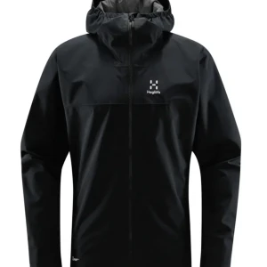 Haglöfs vindjacka  - Snygg svart vindjacka från Haglöfs med huva och dragkedja framtill. Jackan har minimalistisk design med logga på bröstet och är perfekt för blåsiga dagar. Långärmad och tillverkad i syntetmaterial.