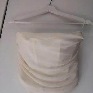 Corsett top  - White/ cream coloured corset top that's rarely ever been used. The top stays perfectly in place and the shear material makes it very pretty.