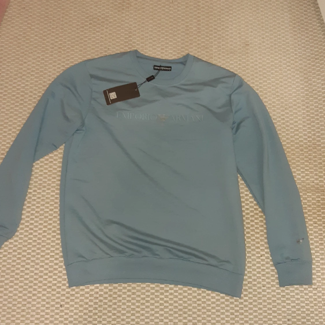 blå tröja från Emporio Armani