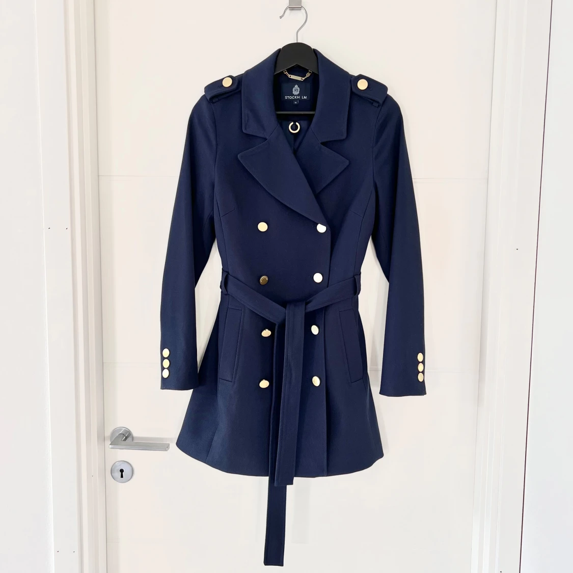 Mörkblå kappa från Stockh lm