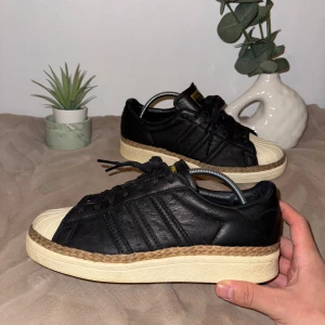 Adidas Originals Superstar 80S New Bold W - Adidas Originals Superstar 80S New Bold W "CORE BLACK"  Size: 39 1/3 Condition: very good  All defects are Always shown in the pictures if there are any!! Questions? Feel free to ask!  Checkout my account for more shoes, you might find a gem you size‼️