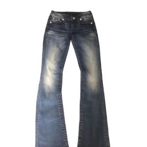 Blå bootcut jeans - Snygga blå bootcut jeans 