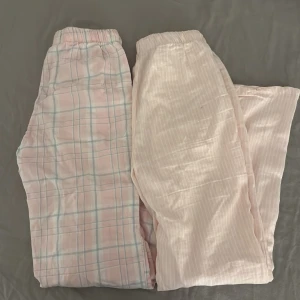 Två par pyjamasbyxor från Gina Tricot - Säljer två par mysiga pyjamasbyxor från Gina Tricot. Ett par är ljusrosa med rutigt mönster i blått och vitt, och det andra paret är ljusrosa med diskreta ränder. Båda är i storlek 158/164 cm