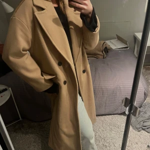 Kappa - Beige kappa som passar strl S/M