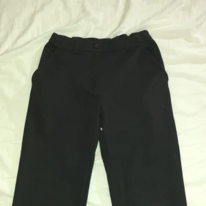 Kostym byxor - Svarta kostym byxor.            