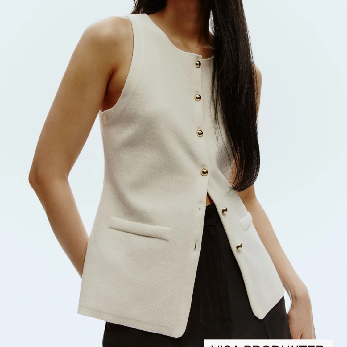 Beige väst med knappar