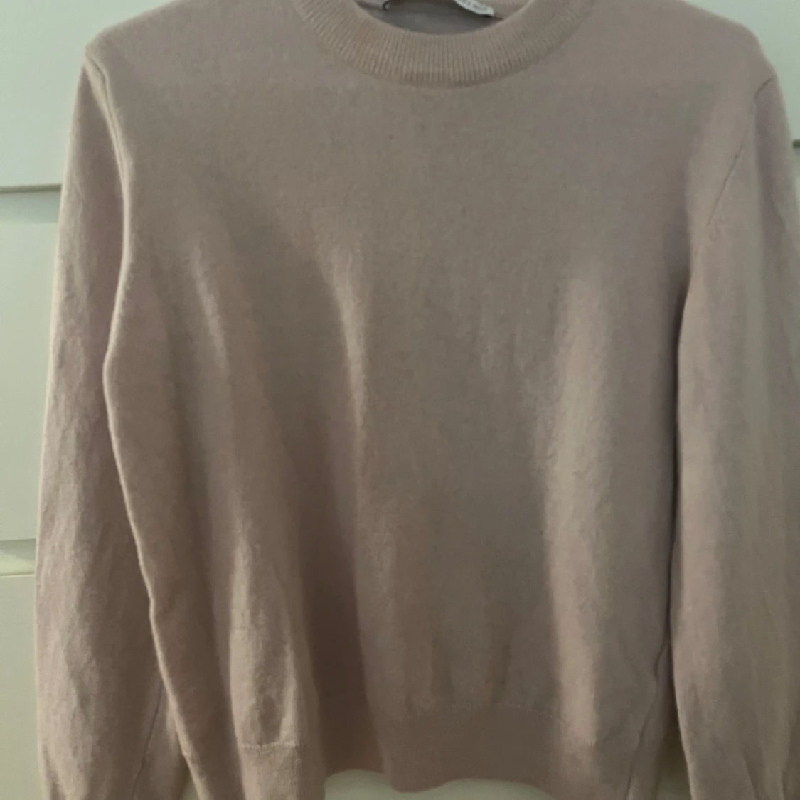 Ljusrosa stickad tröja 