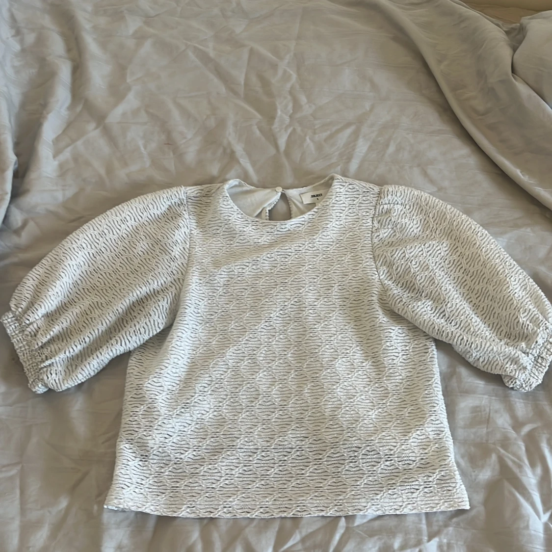 Vit blus från objekt