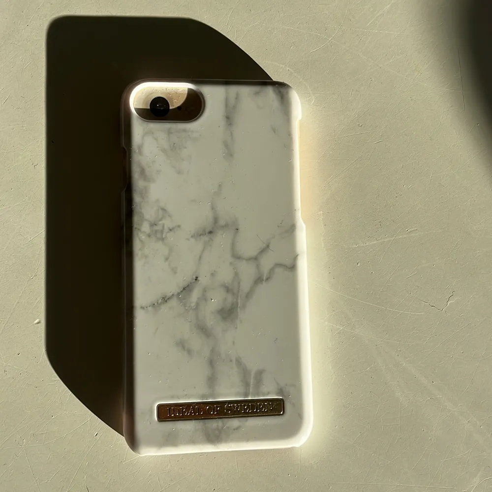  Nytt iPhone skal till 8/7/6/6s , från ideal of sweden, vit marmor . Övrigt.