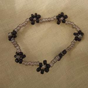 A handmade beaded bracelet with flowers. The elastic material makes it a one size fits all. FREE SHIPPING  Bracelet 59 SEK Ring 39 SEK Bracelet + Ring Set 79 SEK