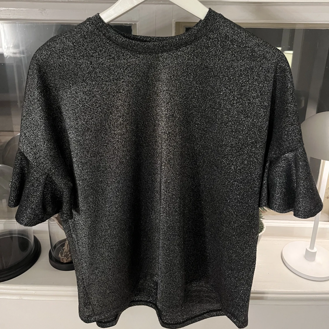 Svart glittrig topp - 90