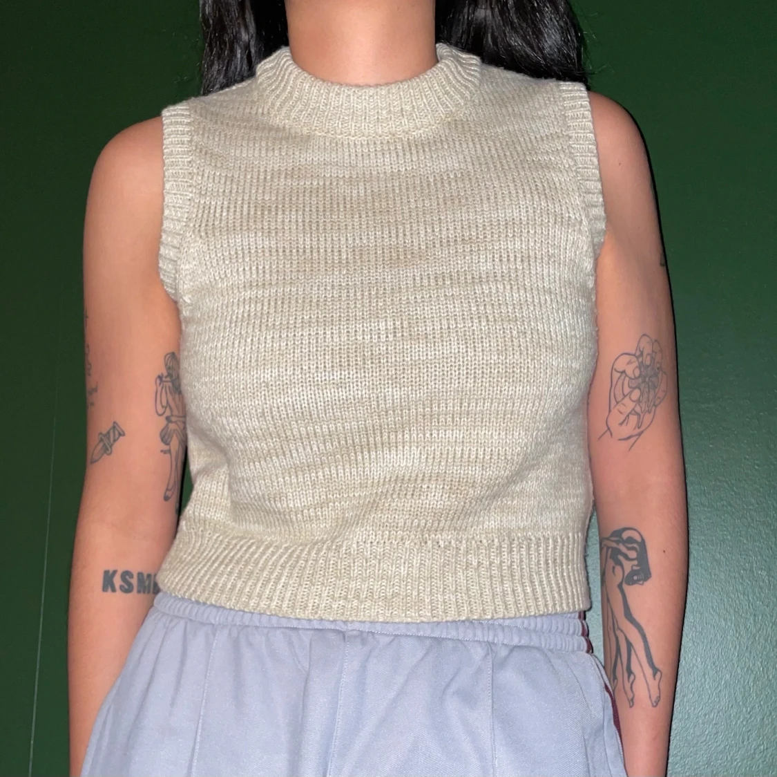 Beige-melerad stickad väst - 90