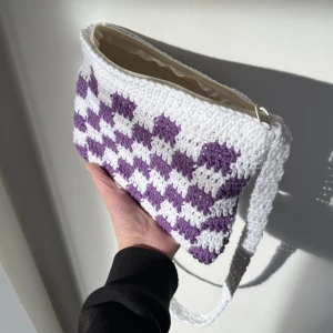 crochet checkered bag with zipper - white and purple checkered crochet bag with a zipper! now you can have a trendy crochet bag but still keep your belongings safely zipped up. medium size, crocheted with 100% cotton yarn. fits any and all everyday items you may need! dm w inquires 💜🤍