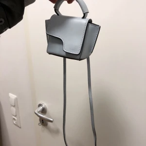 ATP Atelier väska - Miniväska i babyblå från ATP Atelier, sparsamt använd! Köpt från Sellpy för 2 år sedan.