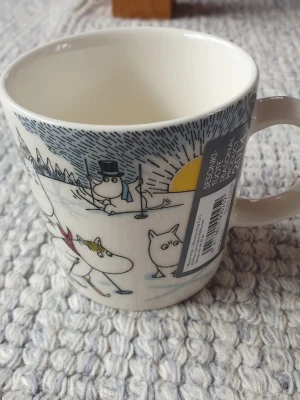 Muminmugg Åka skidor med Herr Brisk  - Utgången felfri mugg med etikett kvar. Packar mycket bra. 