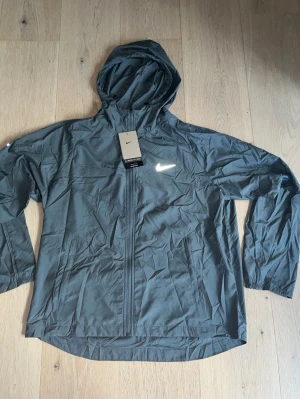 Black Reflective Windbreaker - Black reflective Windbreaker from nike. Size M