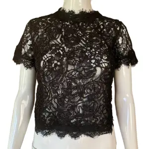 Black see trough lace from Zara. Eur S. Mannequin uses size XS. Flaw seen in second picture, barely noticeable. Condition 8/10. 100% Polyester Measurements:  Shoulder to shoulder 35cm, Sleeve length 17ish, pit to pit 45cm, length (pit & down) 22cm