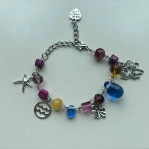 Sjärntecken armband - Aquarius/vattumannen sjärntecken armband. Vattumannen är personer födda mellan 20 januari och 19 februari. Handgjord med glaspärlor.