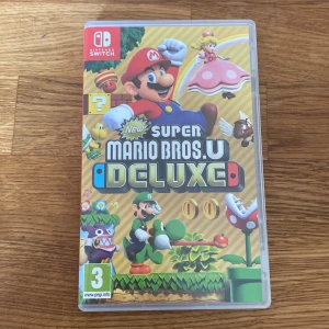 Super mario deluxe till Nintendo switch - Nyskick, använd ett fåtal gånger, nypris 579kr 