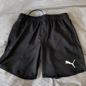 Puma badshorts i nyskick. Oanvända. Storlek S.