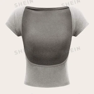 Topp med öppen rygg  - Storlek xs men mycket stretchigt material så går att ha med s och m