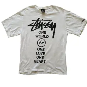 STUSSY Fragment collab T-shirt   Size: S  Released in 2011  East Japan Earthquake Charity T-shirt  JAPAN EARTHQUAKE RELIEF PROJECT 2011  Excellent Condition     Measurements Top: Width: 46cm Length: 65cm