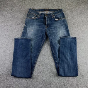 Nudie Jeans Grim tim - Snygga Nudie Jeans med snygg wash. Storleken är 33/34. Minimala defekter förekommer så skriv för information