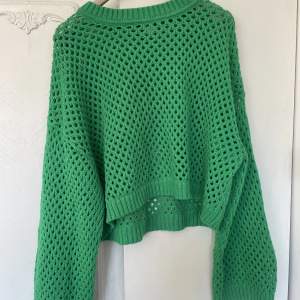 En fin grön tröja med nät, använd fåtal gånger. 