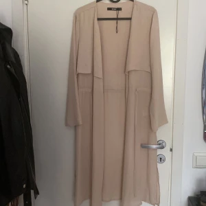 Tunn trenchcoat - Aldrig använd 