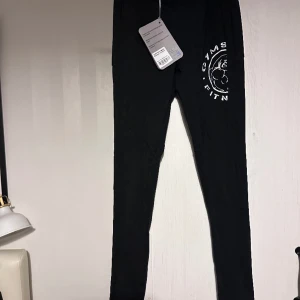 Gymshark Legacy Leggings Tights XS - New With Tags. Selling since it fits kinda small for XS. High waisted and has panels and a pocket. Opaque. Can send you more measurements or pics of the item. Smoke and pet free storage space. 