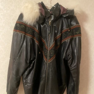 Leather Jacket with fur  - Unbelievably beautiful vintage real leather jacket made in UK with real fur on the hood. It’s in very good condition. It’s heavy, but comfortable and cozy. 