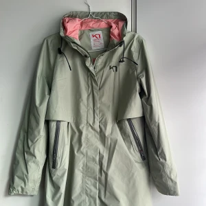 Regnkappa - Oanvänd regnkappa, storlek M 