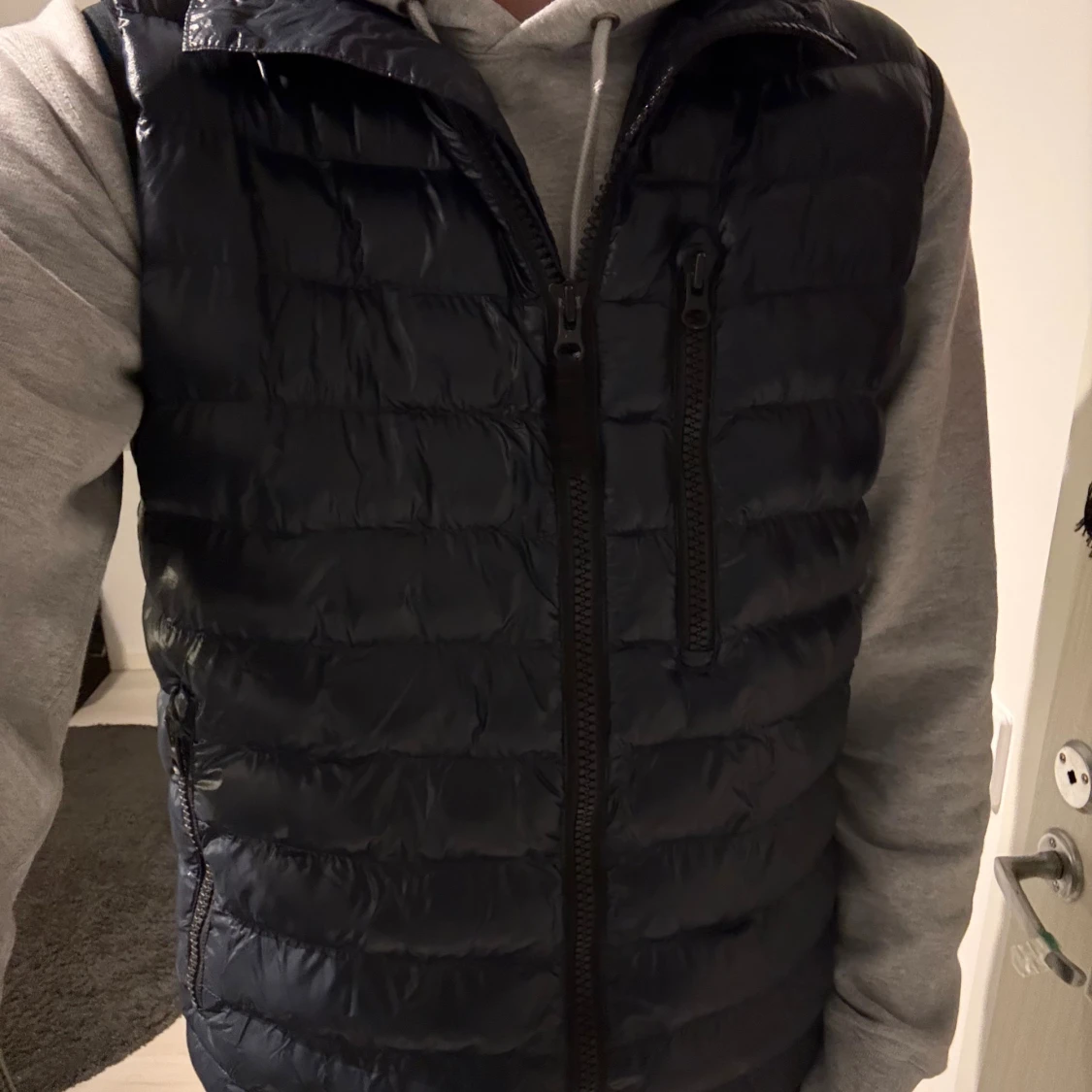 Blå dunväst Peak Performance S