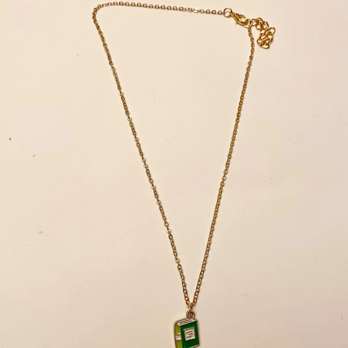 Halsband bok guld imitation  - 1