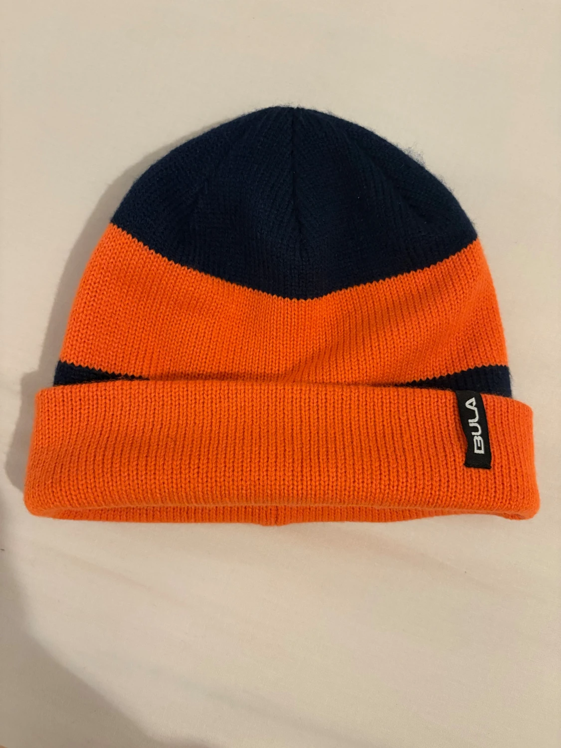 Randig mössa från Bula i orange och marinblå - 1