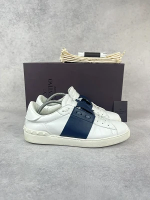 Valentino  Open sneakers  - – Condition: 8/10 - general wear  – Color: White and navy blue  – What is included: Box, dustbag & card  – Retail price: 7280