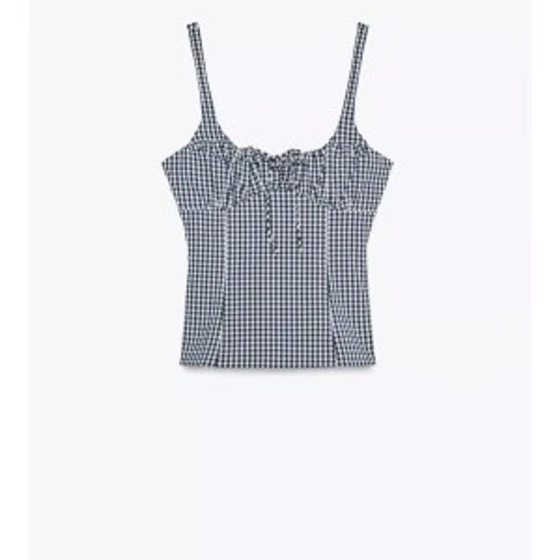 Rutig svartvit linnetopp med snörning