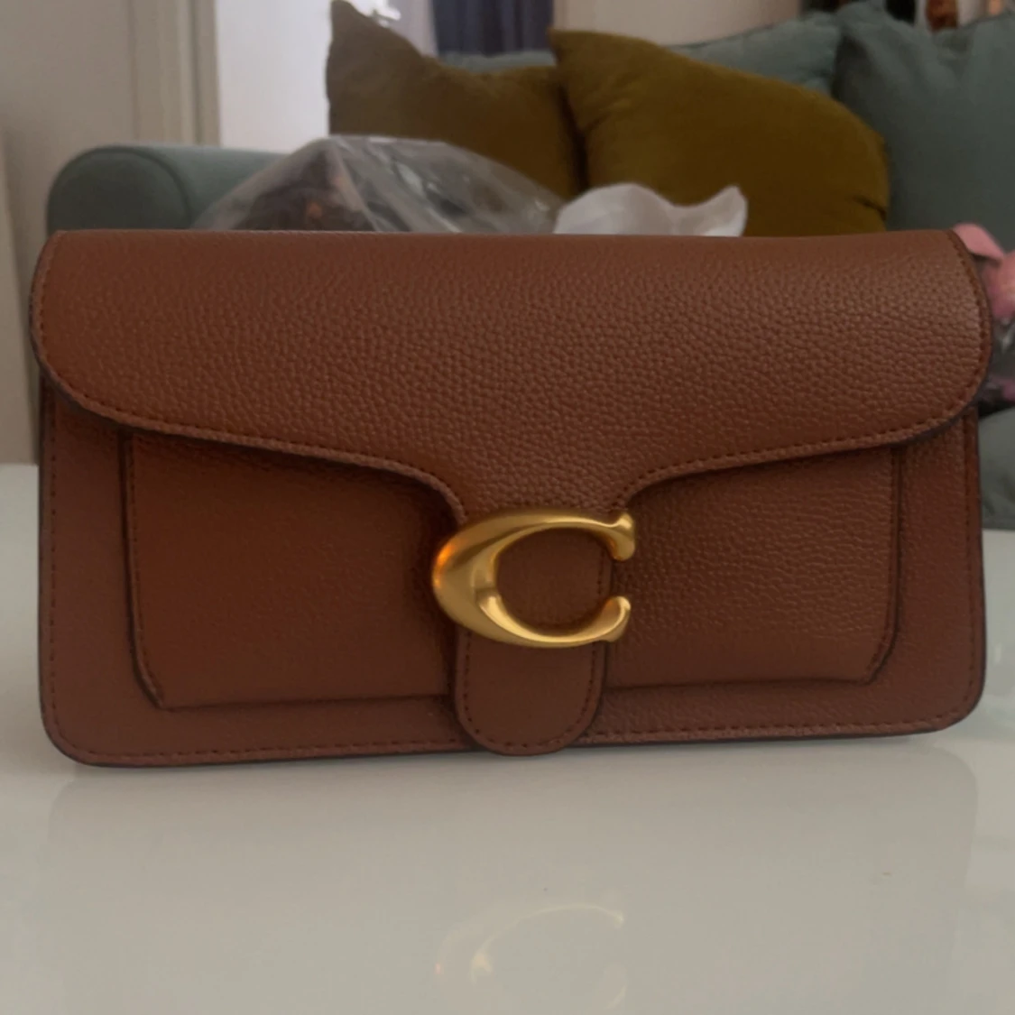 Brun axelväska från Coach i skinn