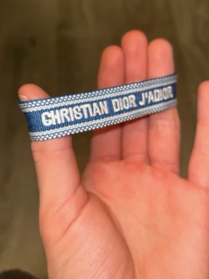 Dior armband  - Mörkblått dior armband med justerbara tofsar