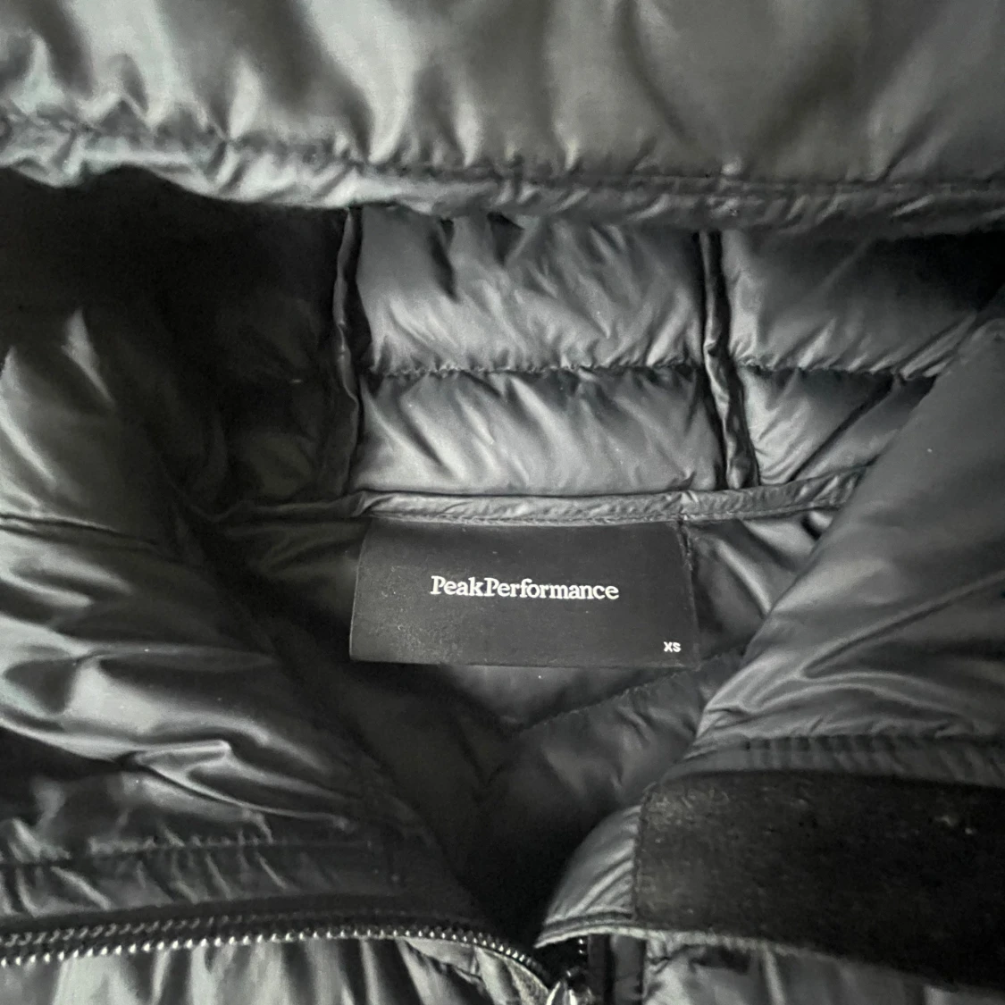 Svart dunjacka Peak Performance XS - 1