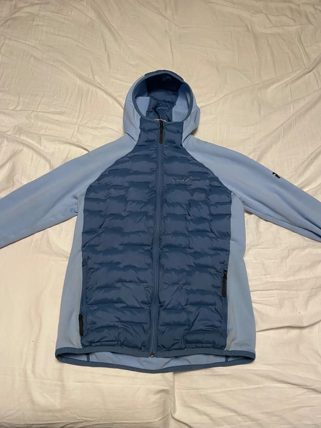 Ljusblå pufferjacka Peak Performance