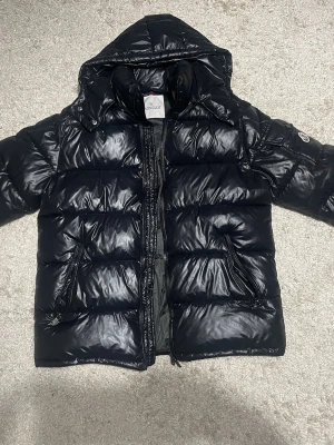 Moncler jacket  - Very good and warm jacket, the logo can be scanned and very good quality, just need to be puffed and it will look like a new one, contact me for more info 