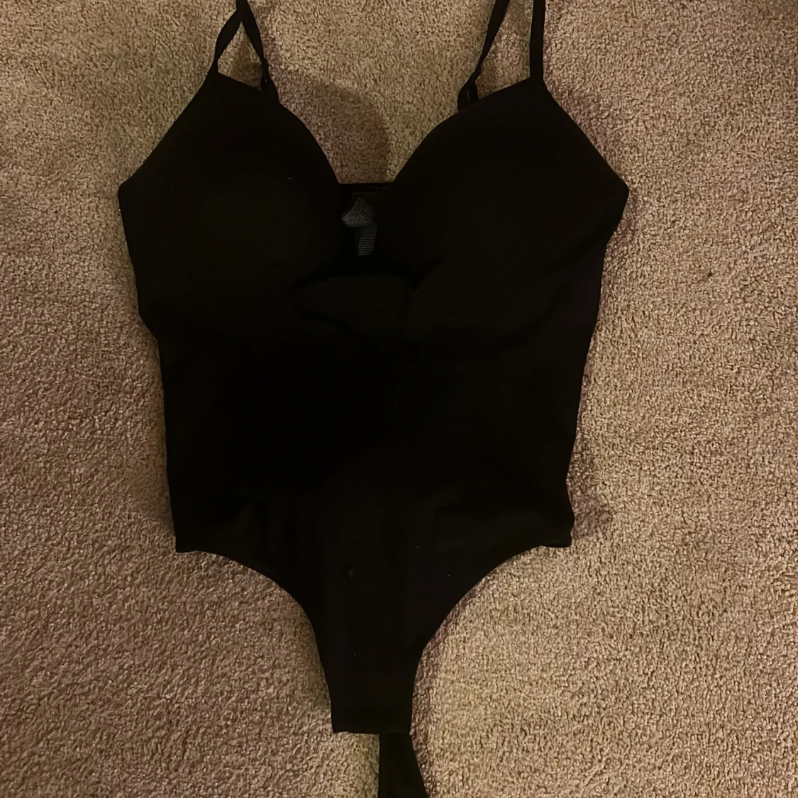 Svart bodysuit från H&M, storlek L