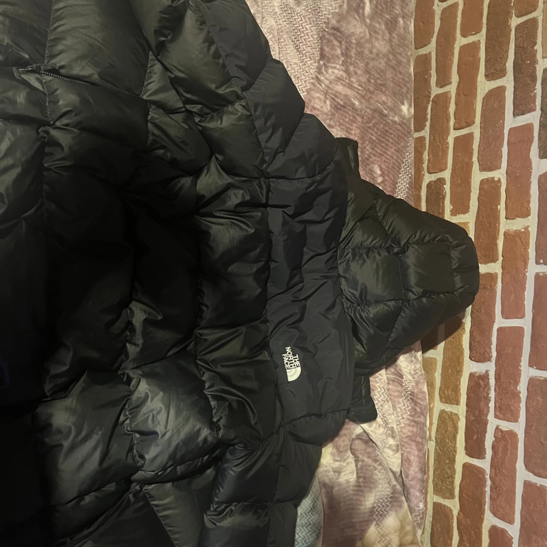 Svart dunjacka från The North Face