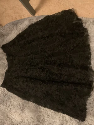 Black gothic skirt - Gothic black skirt with rose pattern all over its so beautiful, waist 30cm, length 48 cm I loove this skirt but its too small for me
