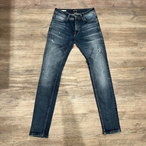 Mörkblå skinny jeans från Jack & Jones - Mörkblåa jeans från Jack & Jones, storlek 29-32