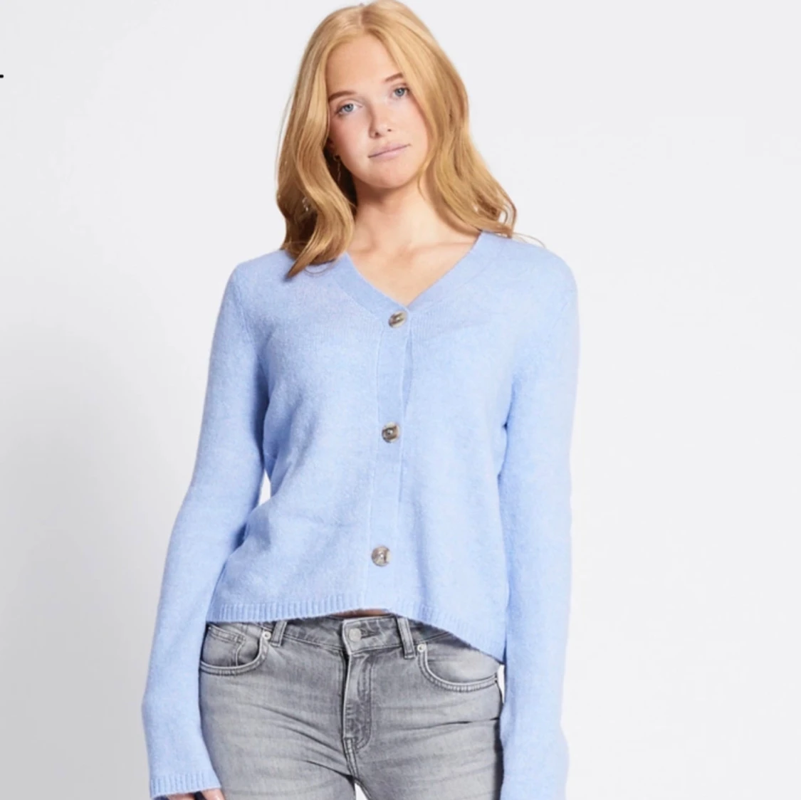 Ljusblå stickad kofta med knappar